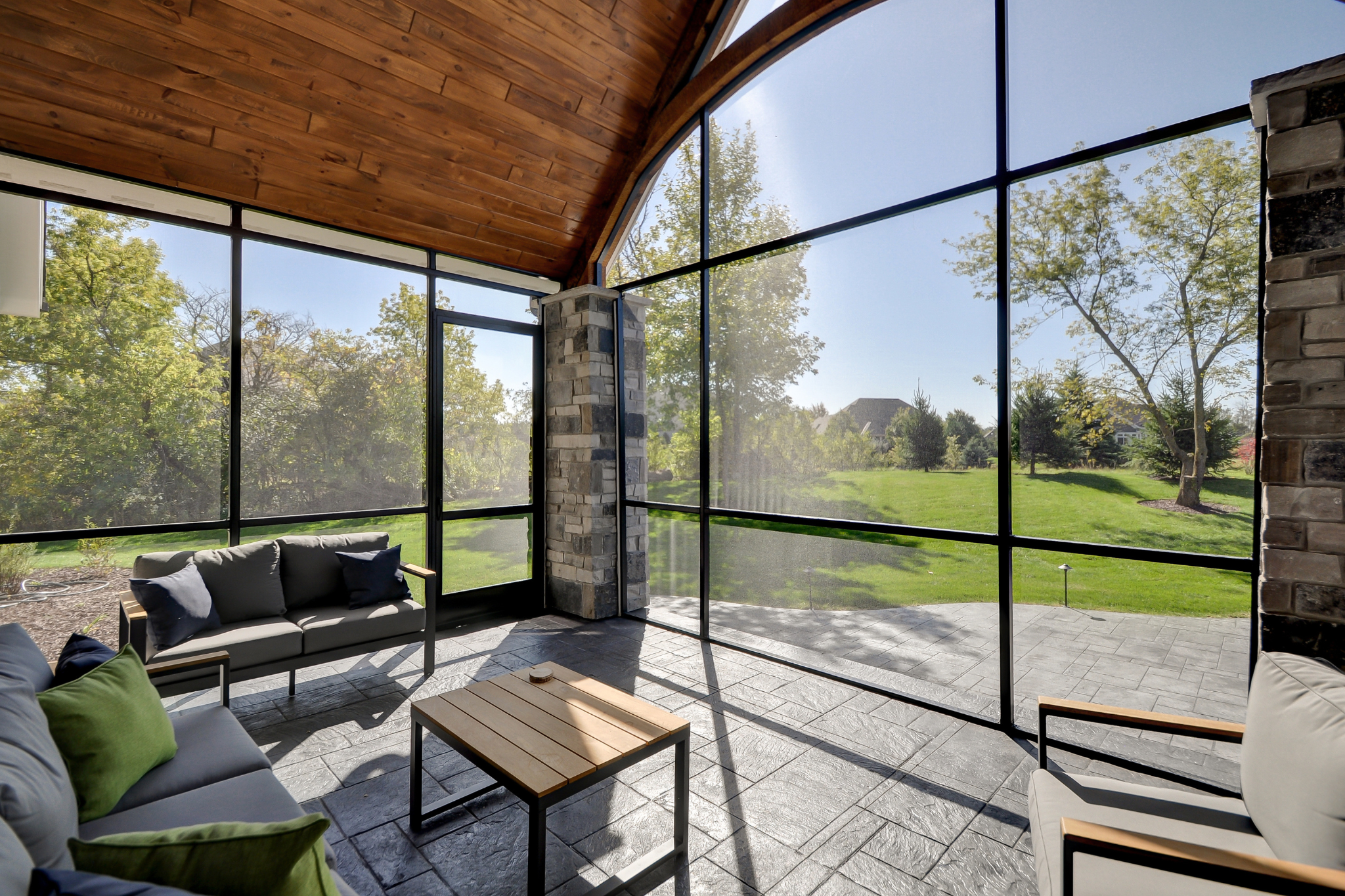 Screened-in porch with a beautiful view, created by Residential in Architects Wisconsin.