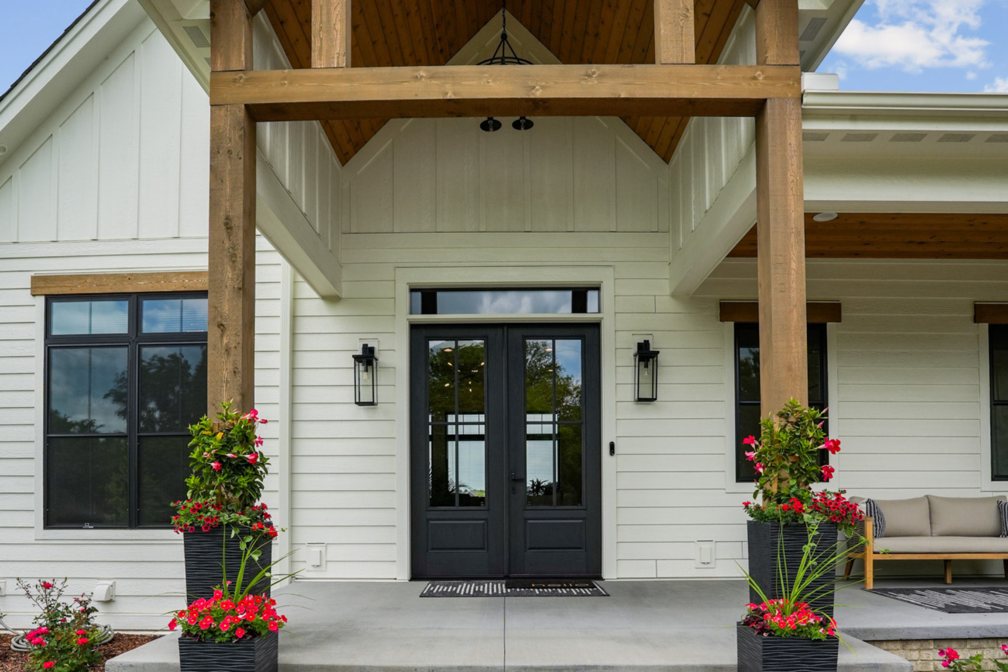 the front of a custom designed built home, designed by redleaf homes in 2024