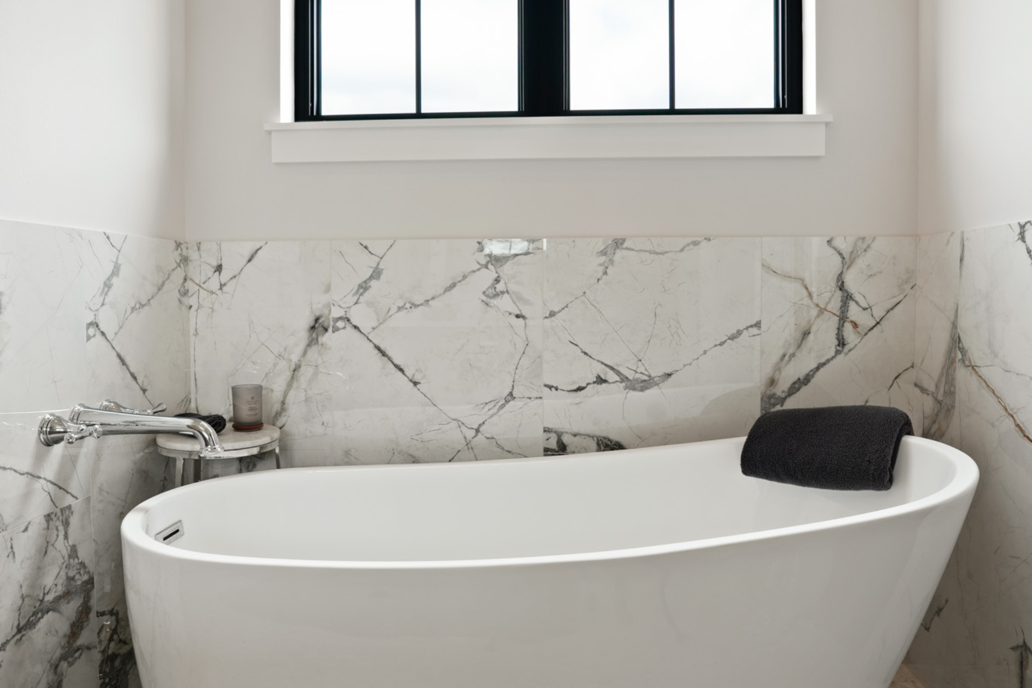 a beautiful marble custom designed bathroom by redleaf homes in new berlin, wi