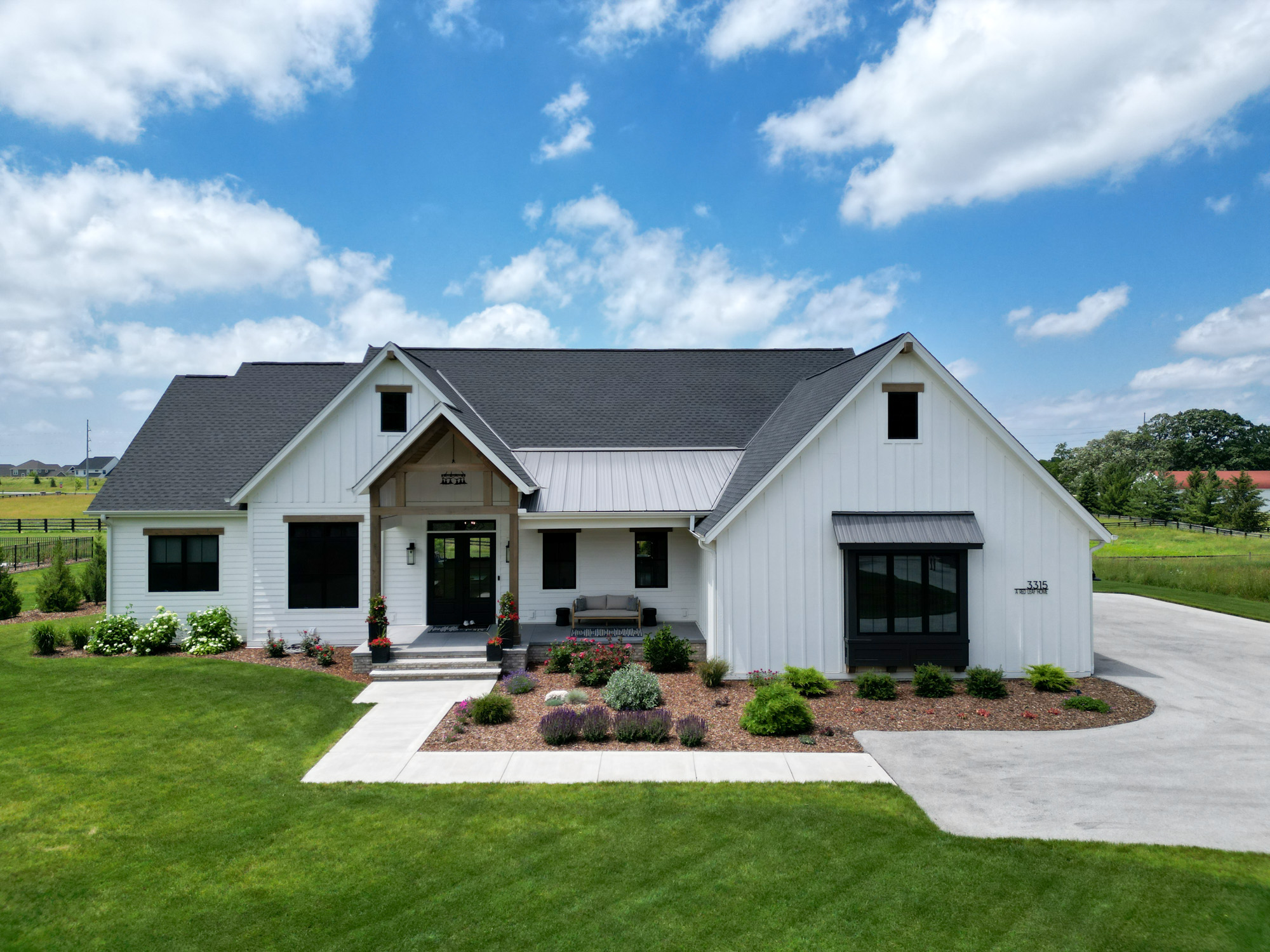 a custom designed home in summit, wi, by redleaf homes. modern farmhouse style.