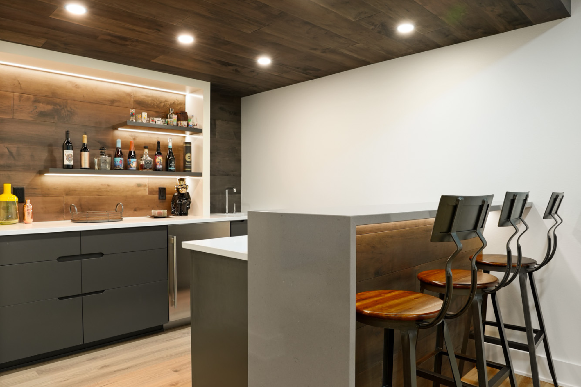 Sleek, modern home bar in a custom-designed Pewaukee home, highlighting personalized features in custom home design.