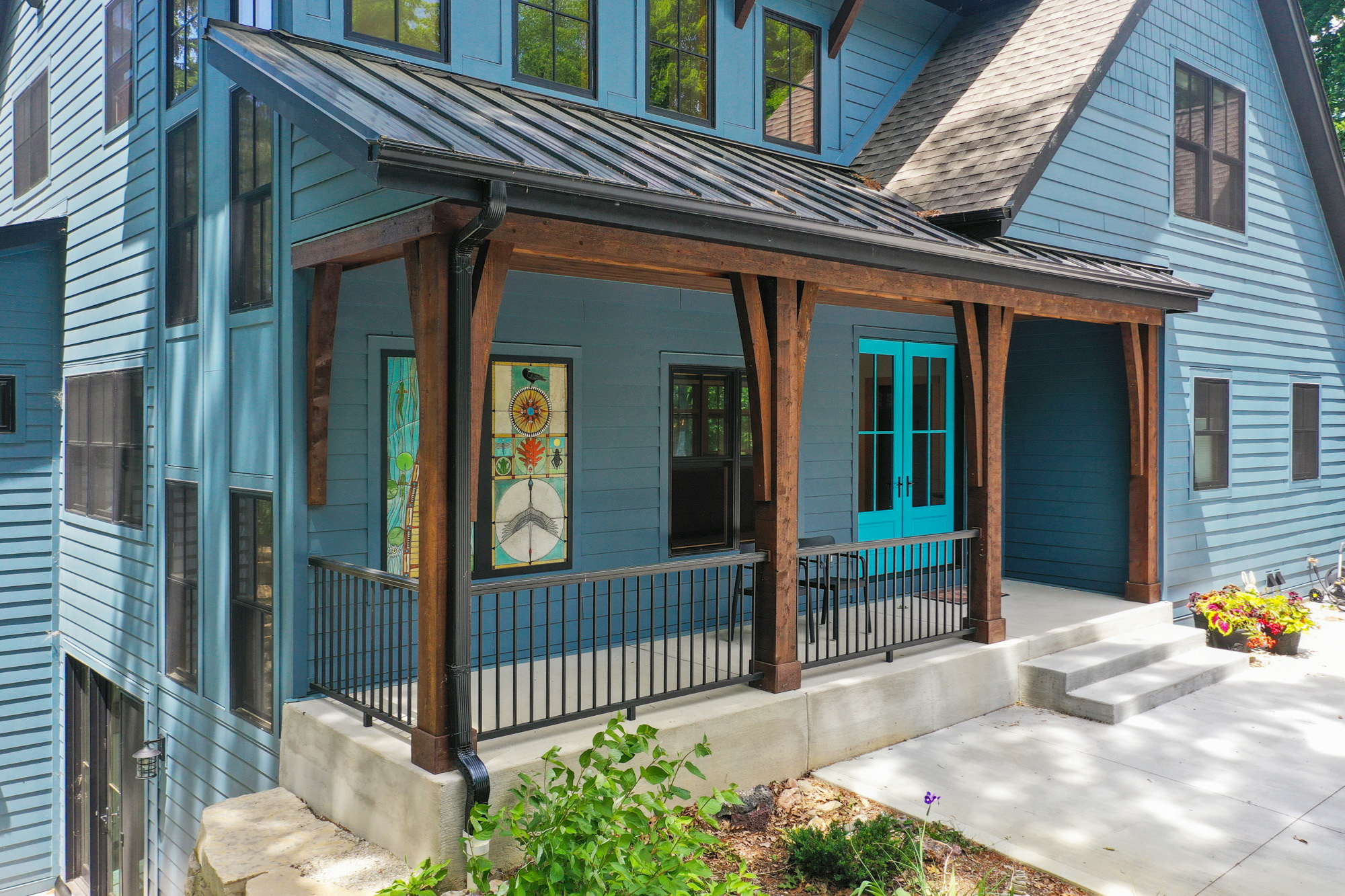 A beautiful front porch of a custom home in Brookfield, designed with flood-resistant features for long-lasting durability.