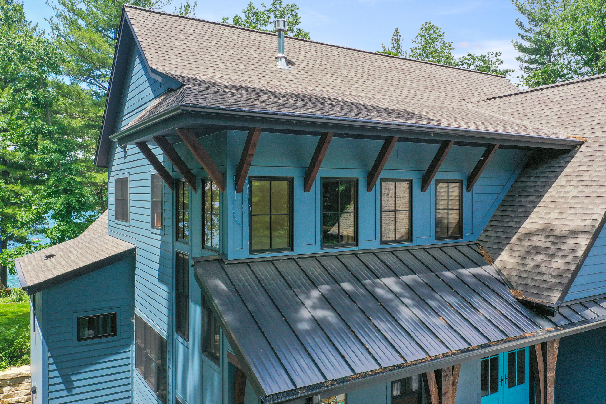 Close-up of the elevated roof structure on a Brookfield custom home, showcasing key elements of flood-resistant home design.